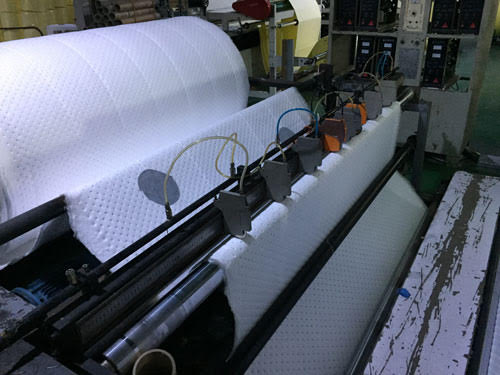 Non woven perforating machine